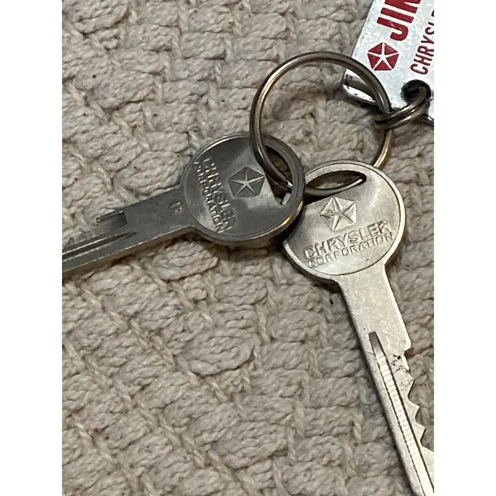 Vintage Jim Clark Chrysler Plymouth Dodge VW Isuzu Key Fob Lawrence KS Metal Tag